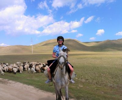 Megan Hassett Cycling on the  tour with redspokes